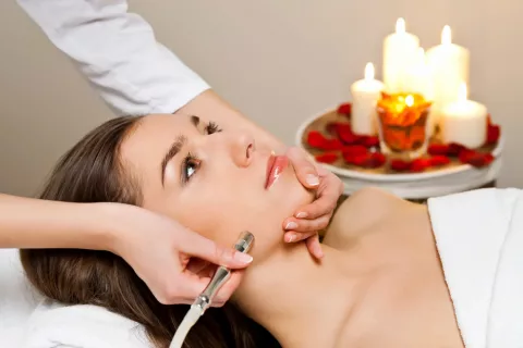 Woman receiving skin treatment