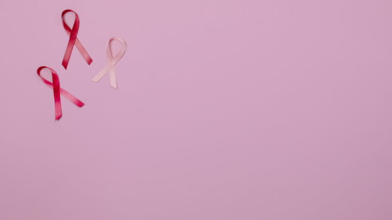 breast cancer awareness ribbon on pink background