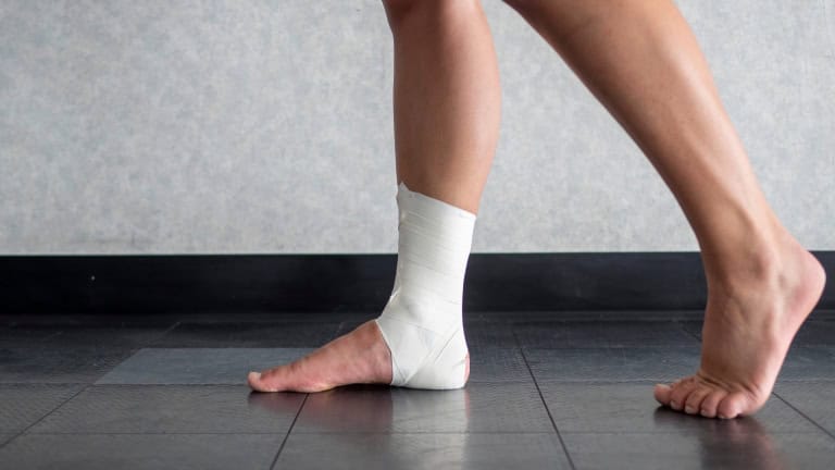 a person with a bandage on their foot
