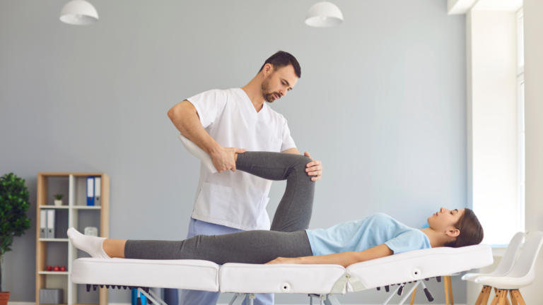 massage therapist stretching client
