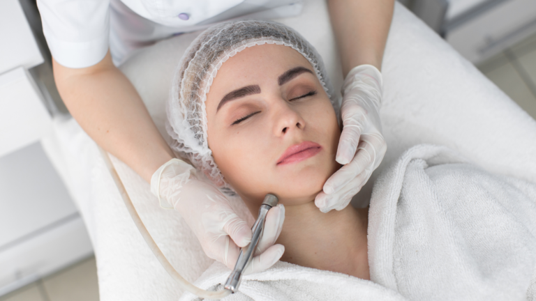 A woman receives a facial treatment at a medical spa